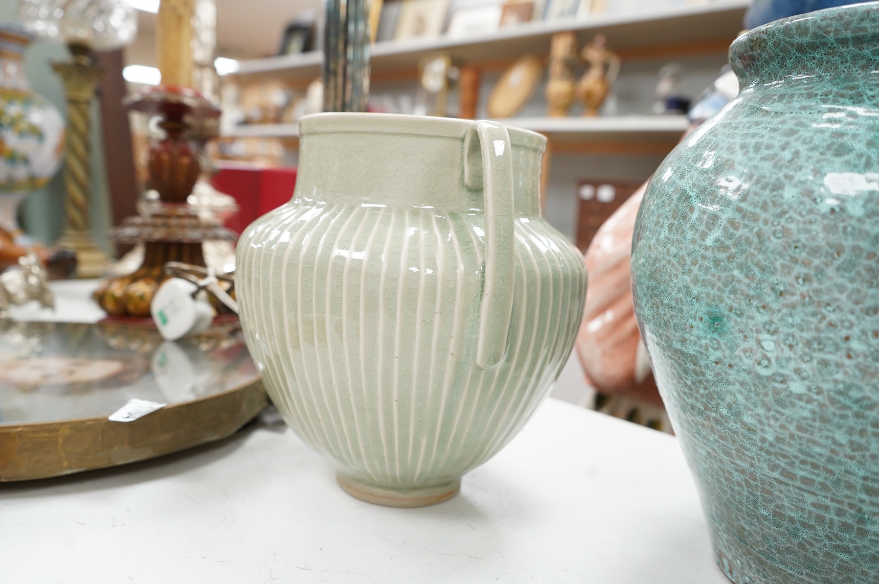 A group of Continental green glazed earthenware vessels including a crystal glazed jug, largest 29cm high